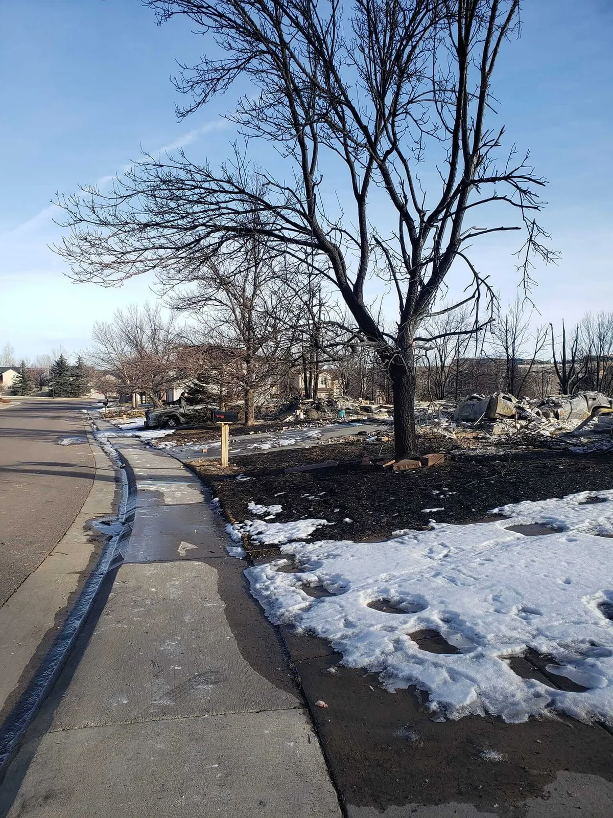 picture of a snowy sidewalk after a fire