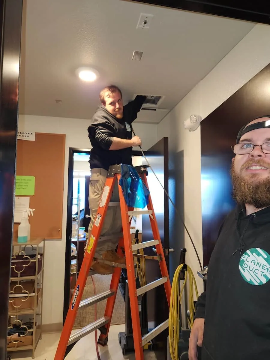 Planet Duct air duct cleaners manually inspecting ductwork